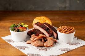 Smokey D's BBQ signature dishes Baby Back Ribs, Sliced Beef Brisket, Pulled Pork, Smoked Chicken Wings, BBQ Nachos.